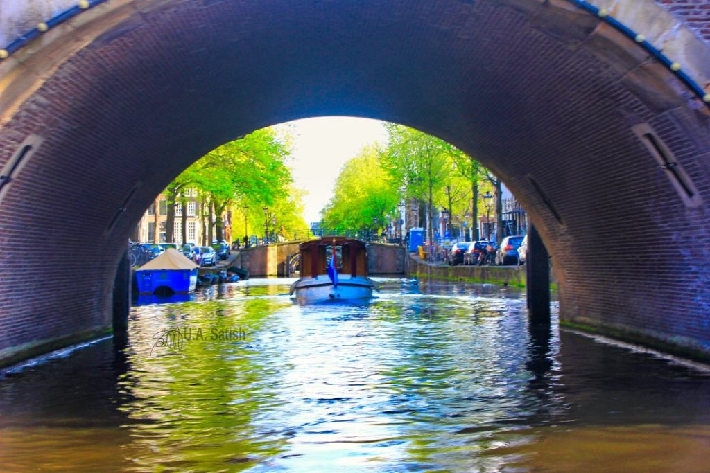 Amsterdam Canal; Amsterdam; Netherlands; boat; arch; canal; uasatish;