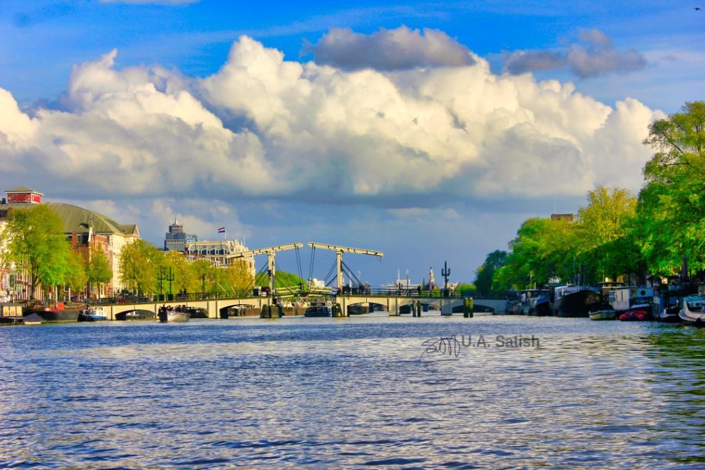 Skinny Bridge; Amsterdam; Amsterdam Canal Cruise; uasatish; sky; clouds; trees;