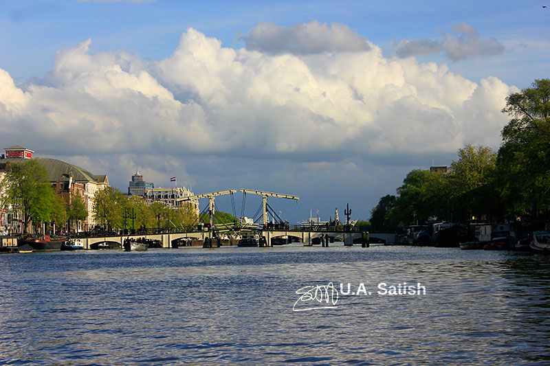 Skinny Bridge; Magere Brug; Amsterdam; Netherlands; bridge; Amstel River; river; water; clouds; sky; outdoor; uasatish;; top 5 sights in Amsterdam;