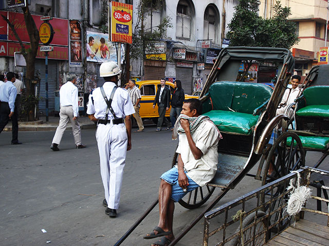 Esplanade; India; outdoor; rickshaw; car; uasatish; policeman; people;