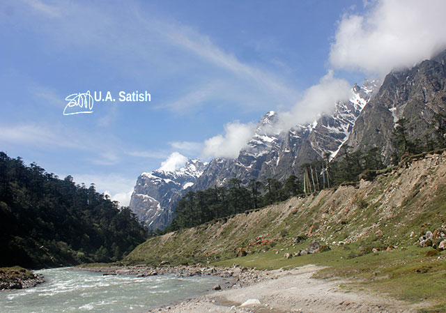 Yumthang; valley; Sikkim; India; stream; mountains; trees; sky; clouds; rocks; uasatish;