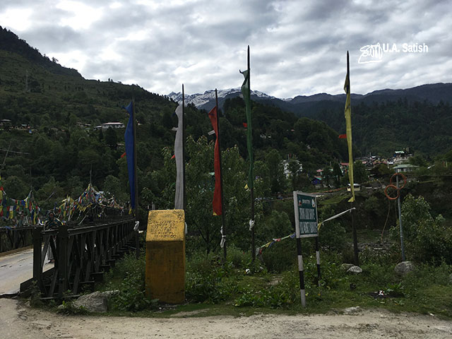 Lachung; Sikkim; India; bridge; sky; flags; clouds; uasatish;