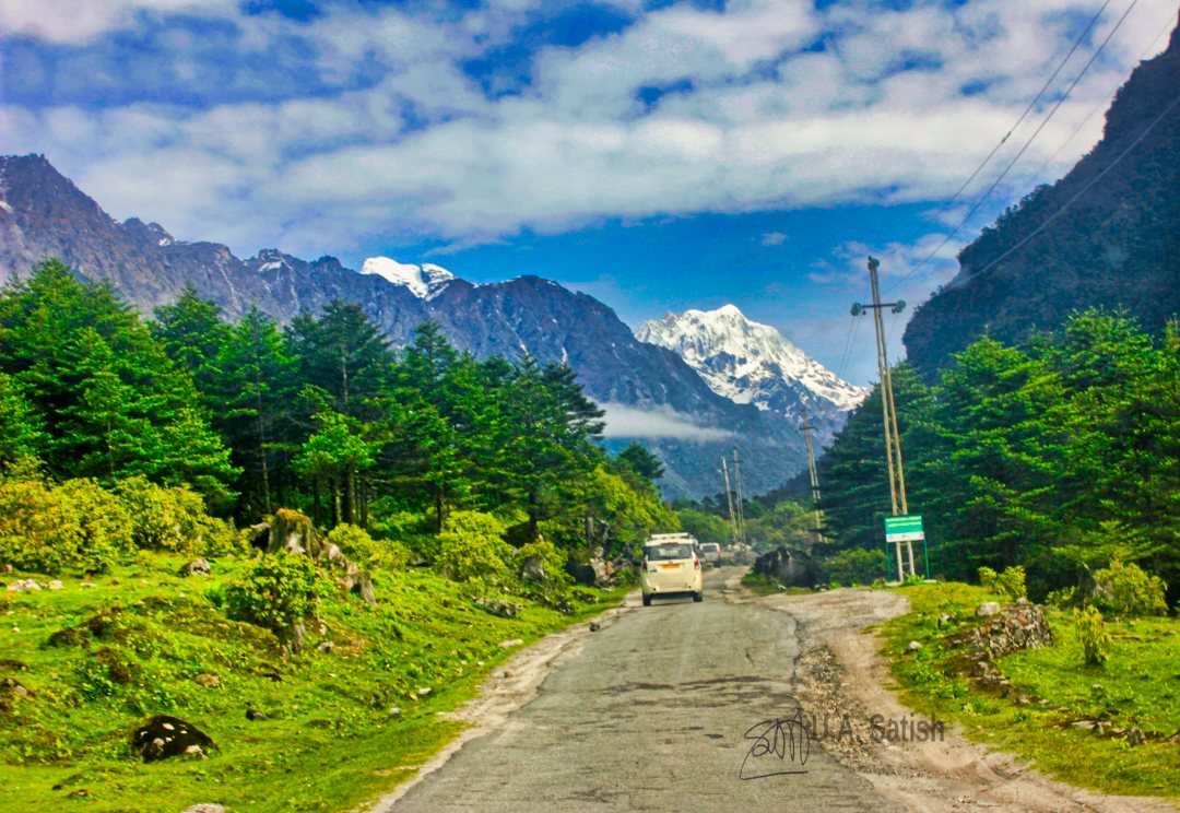 North Sikkim; mountains; snow; sky; clouds; trees; road; car; uasatish;
