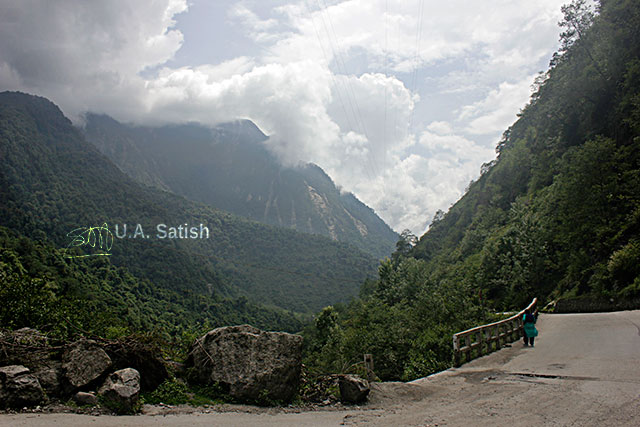 Sikkim; India; North Sikkim; road; mountains; bridge; clouds; rocks; sky; uasatish;