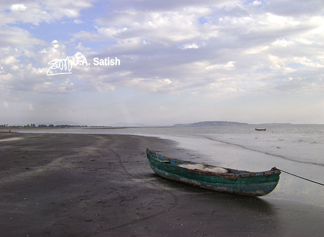 Rangaon Beach; Vasai; beach; India; boat; sand; sky; clouds; uasatish;